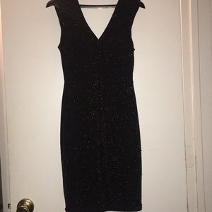 Black mini dress with gold reflects. (Not glitter)